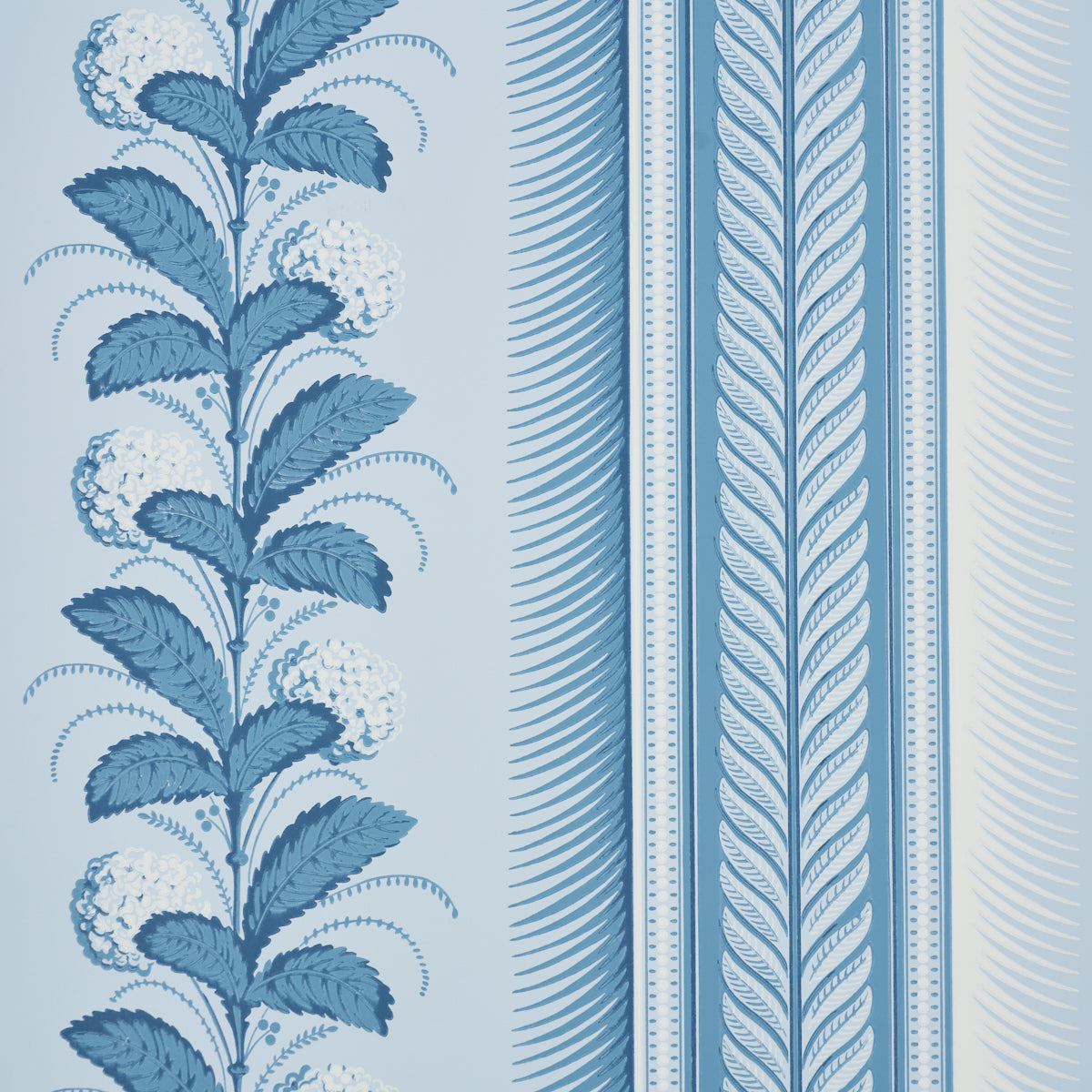Hydrangea Drape wallpaper in Delft blue and white, featuring large-scale floral stripes and ornate borders, styled in various elegant interiors.