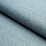 HARUKI SISAL Cornflower blue textured sisal wallcovering by Schumacher, shown in a bedroom and detail views.