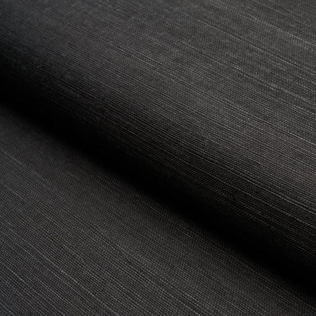 HARUKI SISAL Jet black textured sisal wallpaper by Schumacher, shown in a close-up and in a stack of colorways.