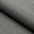 HARUKI SISAL Charcoal textured sisal wallcovering by Schumacher, shown in close-up and styled interior settings.