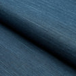 HARUKI SISAL Indigo wallcovering by Schumacher, shown in a close-up of its textured, woven surface.