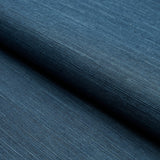 HARUKI SISAL Indigo wallcovering by Schumacher, shown in a close-up of its textured, woven surface.