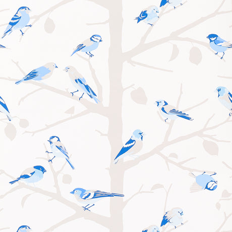 A-TWITTER wallpaper in blues by Schumacher featuring whimsical blue birds perched on branches, shown in a bright, airy bedroom setting.