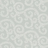 Leafy Scroll Dove wallpaper by Schumacher in a bathroom setting, featuring a scrolling vine pattern in soft grey and white.