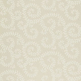 Leafy Scroll wallpaper in Bone by Schumacher, featuring a scrolling vine pattern inspired by embroidery, shown in a bathroom interior.