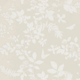 Shadow Vine Bone wallpaper by Schumacher featuring a delicate botanical vine pattern in a soft neutral colorway, shown in a styled interior and close-up detail.