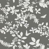Shadow Vine Charcoal botanical wallpaper by Schumacher featuring white silhouettes of vines, leaves, and butterflies on a charcoal background.