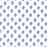 Bakara Leaf Delft blue hand screen printed wallpaper by Schumacher shown in a bathroom interior and close-up pattern view.