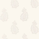 MADRAS PAISLEY wallpaper in Oyster by Schumacher, featuring a hand-screened paisley pattern in a neutral colorway, shown in a bathroom interior.