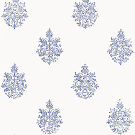 Asara Flower Delft blue and white floral medallion wallpaper by Schumacher, shown in a styled bedroom and close-up pattern view.