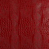 Crimson red crocodile embossed wallpaper with a luxurious, textured finish by Schumacher.