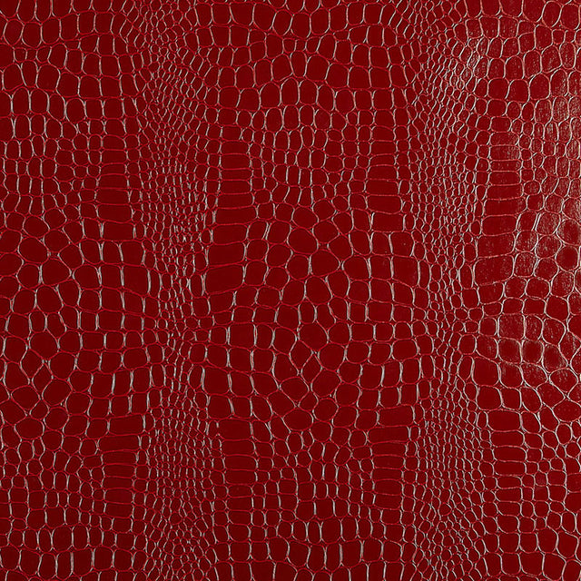 Crimson red crocodile embossed wallpaper with a luxurious, textured finish by Schumacher.