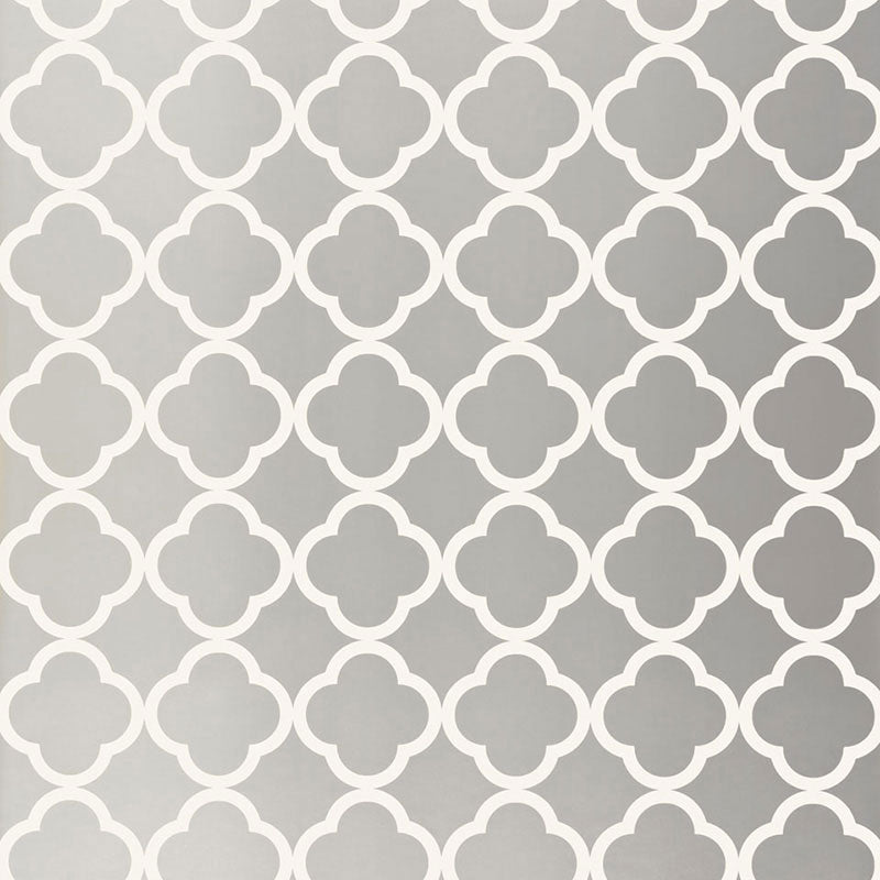 Moroccan-inspired silver geometric wallpaper with quatrefoil pattern by Schumacher