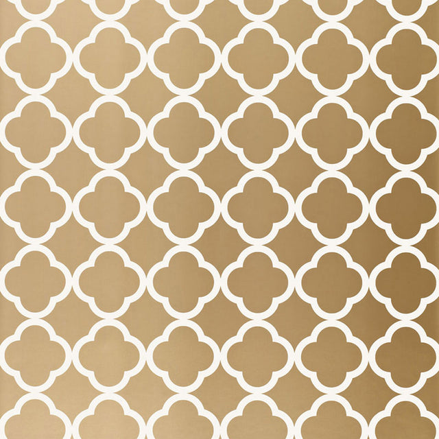 Moroccan-inspired antique gold geometric wallpaper with a quatrefoil pattern by Schumacher.