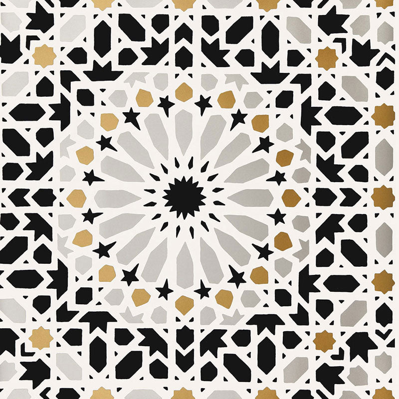 Nasrid Palace Mosaic wallpaper in mica colorway, featuring intricate geometric and star patterns inspired by Moorish design, installed in a bedroom interior.