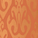 Tokat Cinnabar wallpaper from the Byzantium collection by Schumacher, featuring a bold ornamental pattern in orange and gold tones.