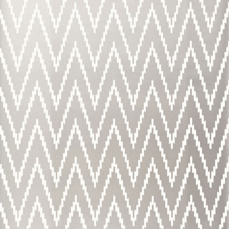 Kasari Ikat Silver wallpaper with a zigzag chevron pattern by Schumacher