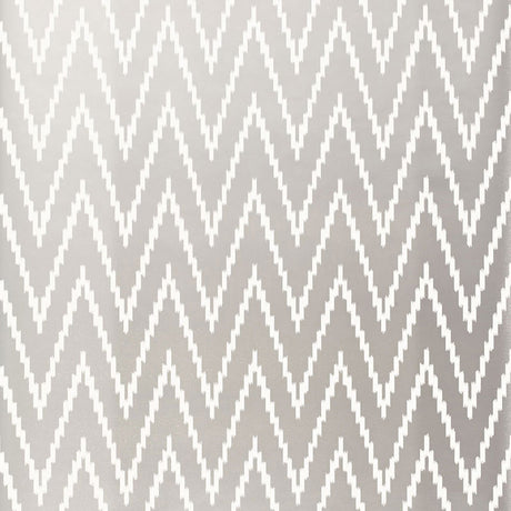 Kasari Ikat Silver wallpaper with a zigzag chevron pattern by Schumacher