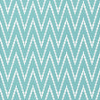 Kasari Ikat Azure wallpaper with a bold zigzag ikat pattern in blue and white by Schumacher.