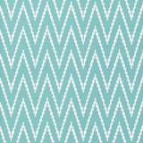Kasari Ikat Azure wallpaper with a bold zigzag ikat pattern in blue and white by Schumacher.