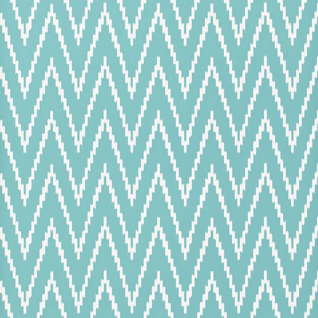 Kasari Ikat Azure wallpaper with a bold zigzag ikat pattern in blue and white by Schumacher.