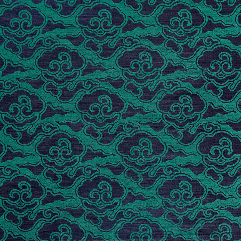 Cirrus Clouds Sisal wallpaper in Plume by Celerie Kemble for Schumacher, hand screen printed with a cloud motif in green and blue.