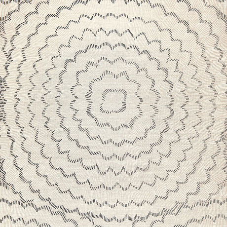 Feather Bloom Sisal wallpaper in Dove by Celerie Kemble for Schumacher, featuring overscale radiating blossoms on a natural sisal ground.