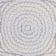 Feather Bloom Sisal wallpaper in Two Blues by Celerie Kemble for Schumacher, featuring overscale radiating blossoms on a natural sisal ground.