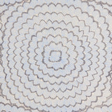 Feather Bloom Sisal wallpaper in Two Blues by Celerie Kemble for Schumacher, featuring overscale radiating blossoms on a natural sisal ground.