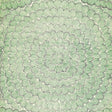 Feather Bloom Sisal wallpaper in Emerald & Ore by Celerie Kemble for Schumacher, featuring overscale radiating blossoms on a natural sisal ground.