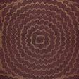 Feather Bloom Sisal wallpaper in Golden Plum by Celerie Kemble for Schumacher, featuring overscale blossoms in a radiating pattern on a natural sisal ground.