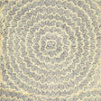 Feather Bloom Sisal wallpaper in Onyx & Gold by Celerie Kemble for Schumacher, featuring overscale blossoms in a radiating pattern on a natural sisal ground.