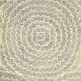 Feather Bloom Sisal wallpaper in Onyx & Gold by Celerie Kemble for Schumacher, featuring overscale blossoms in a radiating pattern on a natural sisal ground.