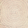 Feather Bloom Sisal wallpaper in Venetian Pink by Celerie Kemble for Schumacher, shown in a bedroom interior and close-up detail.