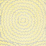 Feather Bloom Sisal wallpaper in Sun & Fog by Celerie Kemble for Schumacher, featuring overscale blossoms in a radiating pattern on a natural sisal ground.