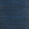 Zen Bamboo Ultramarine wallpaper by Schumacher shown as a textured blue wallcovering and installed in a modern bathroom setting.