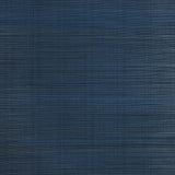 Zen Bamboo Ultramarine wallpaper by Schumacher shown as a textured blue wallcovering and installed in a modern bathroom setting.