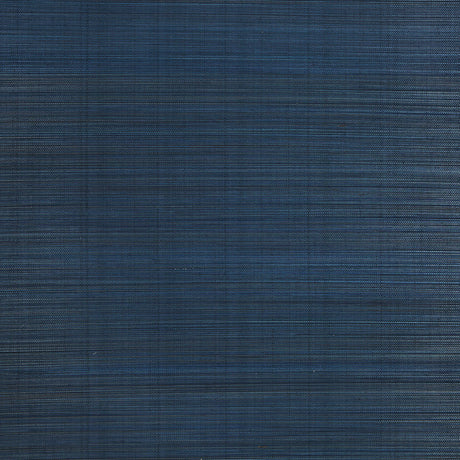 Zen Bamboo Ultramarine wallpaper by Schumacher shown as a textured blue wallcovering and installed in a modern bathroom setting.