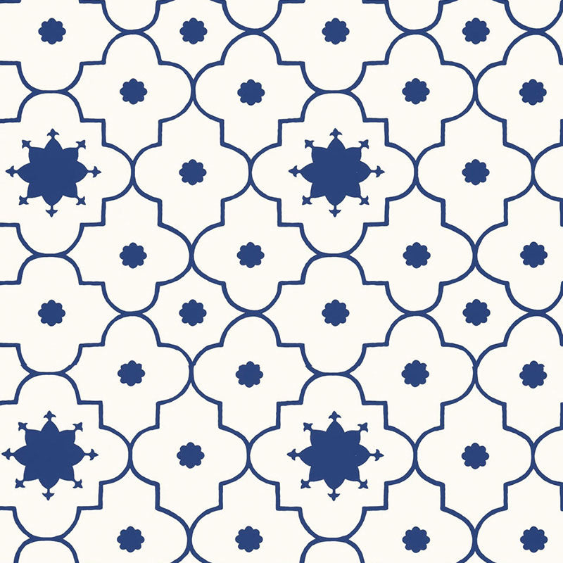 Taj Trellis wallpaper in Jaipur Blue by Schumacher, featuring a bold geometric trellis pattern in blue and white.