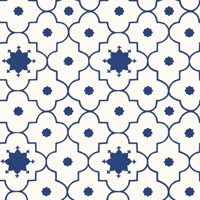 Taj Trellis wallpaper in Jaipur Blue by Schumacher, featuring a bold geometric trellis pattern in blue and white.
