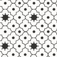 Taj Trellis Noir wallpaper by Schumacher shown in a modern interior with bold black and white geometric trellis pattern.