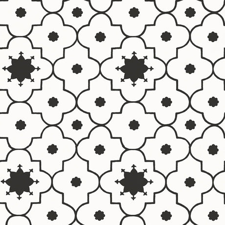 Taj Trellis Noir wallpaper by Schumacher shown in a modern interior with bold black and white geometric trellis pattern.