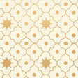 Taj Trellis wallpaper in Burnished Gilt by Schumacher, featuring a Moroccan-inspired geometric trellis pattern in gold on a cream background.