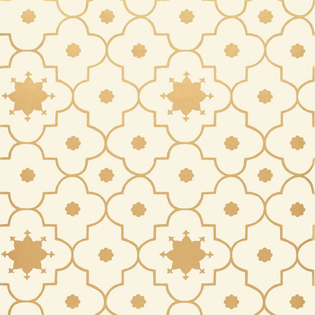 Taj Trellis wallpaper in Burnished Gilt by Schumacher, featuring a Moroccan-inspired geometric trellis pattern in gold on a cream background.