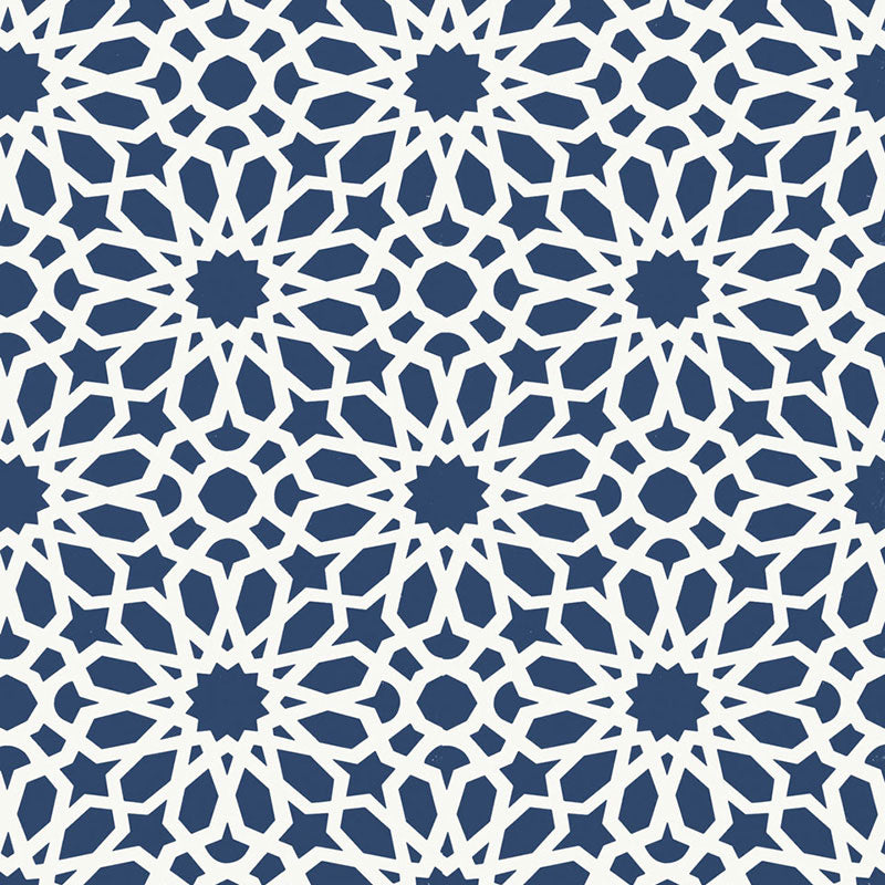 Agadir Screen wallpaper in Lapis by Schumacher, featuring a geometric floral pattern in blue and white, designed by Martyn Lawrence Bullard.