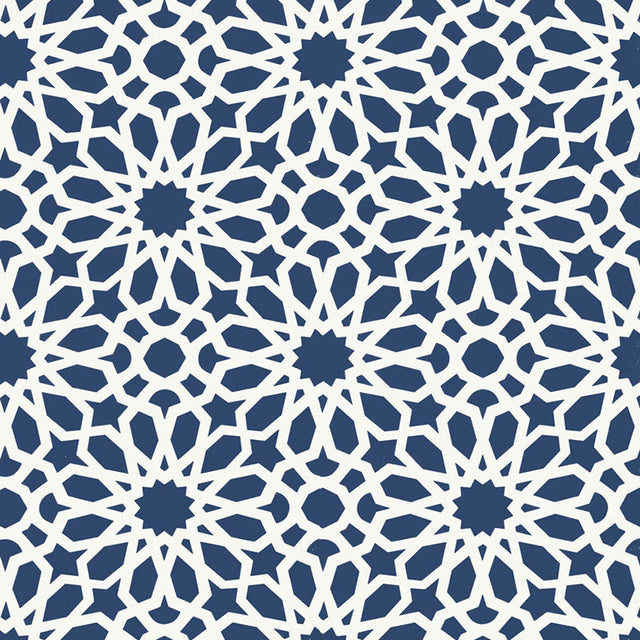Agadir Screen wallpaper in Lapis by Schumacher, featuring a geometric floral pattern in blue and white, designed by Martyn Lawrence Bullard.