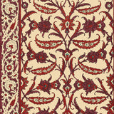Topkapi Pomegranate wallpaper by Schumacher featuring an Ottoman-inspired floral and vine pattern in rich reds and creams, shown in a restaurant interior and close-up.