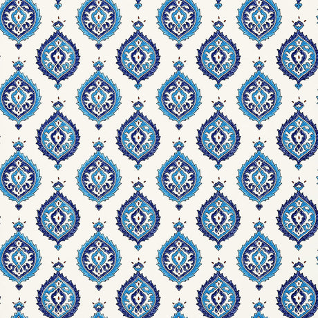 Samovar Peacock wallpaper by Schumacher, featuring a blue and white medallion pattern in a bathroom setting.