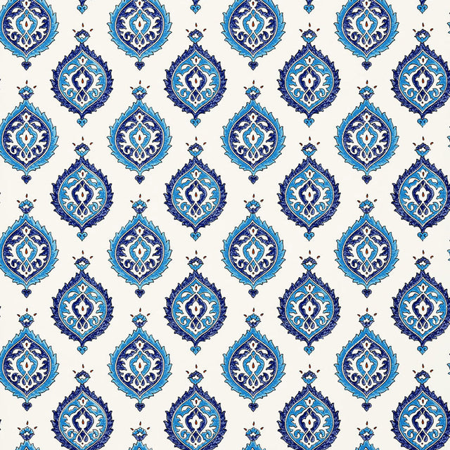 Samovar Peacock wallpaper by Schumacher, featuring a blue and white medallion pattern in a bathroom setting.
