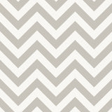 Chevron stripe wallpaper in dusk colorway by Schumacher, styled in a modern entryway.